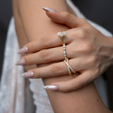 Close-up of a hand wearing ciel ring, celeste ring and vera ring with a blurred background