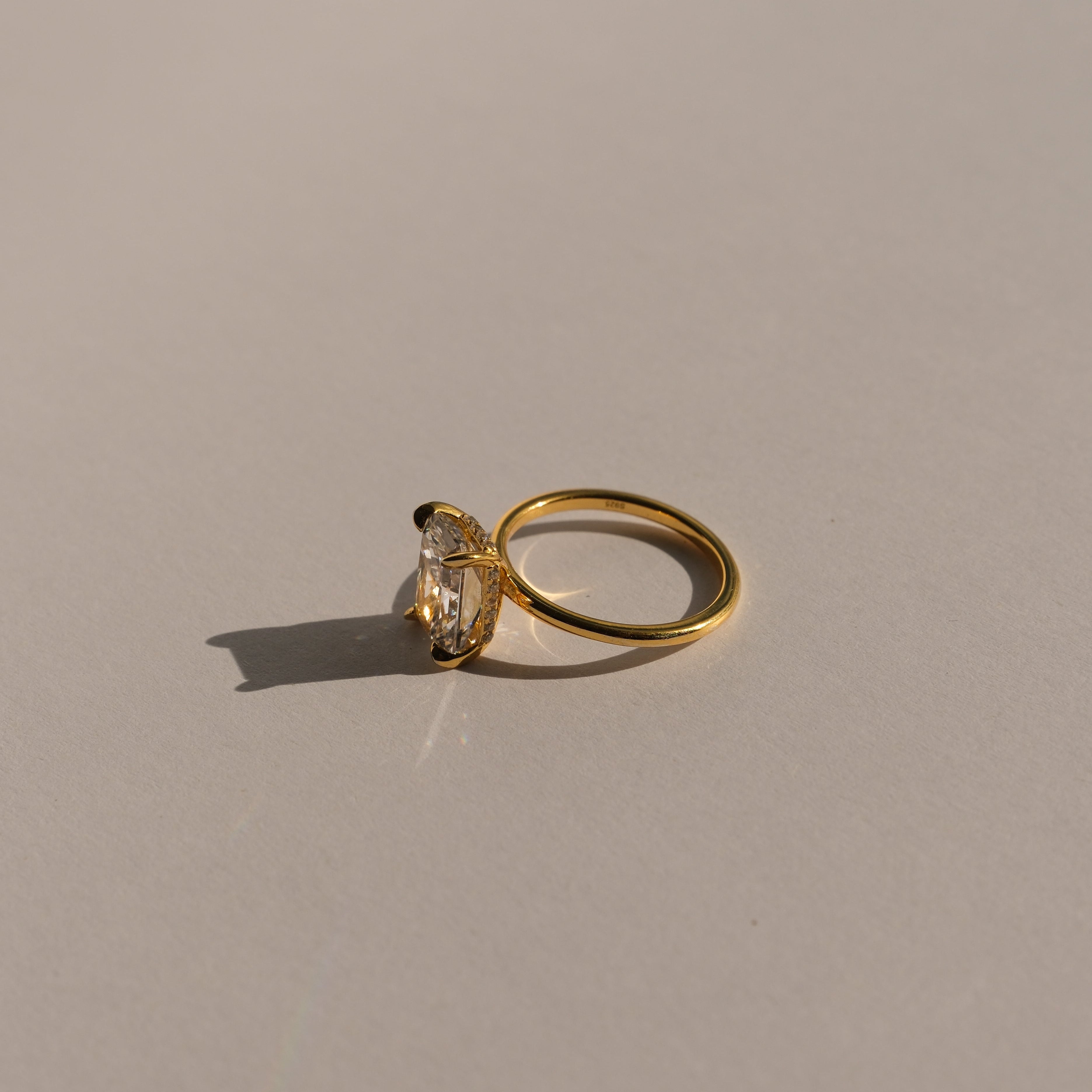 lume jewellery's elodie ring on a beige background