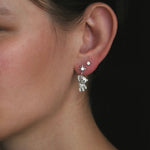 model wearing the starry teddy earrings and stella studs from lume jewellery on her ear 