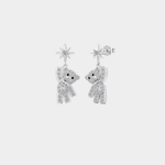 Silver teddy bear earrings on a light gray background