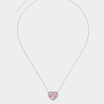 Necklace with a heart-shaped pink pendant on a light gray background