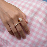 hand wearing elodie ring and dues ring