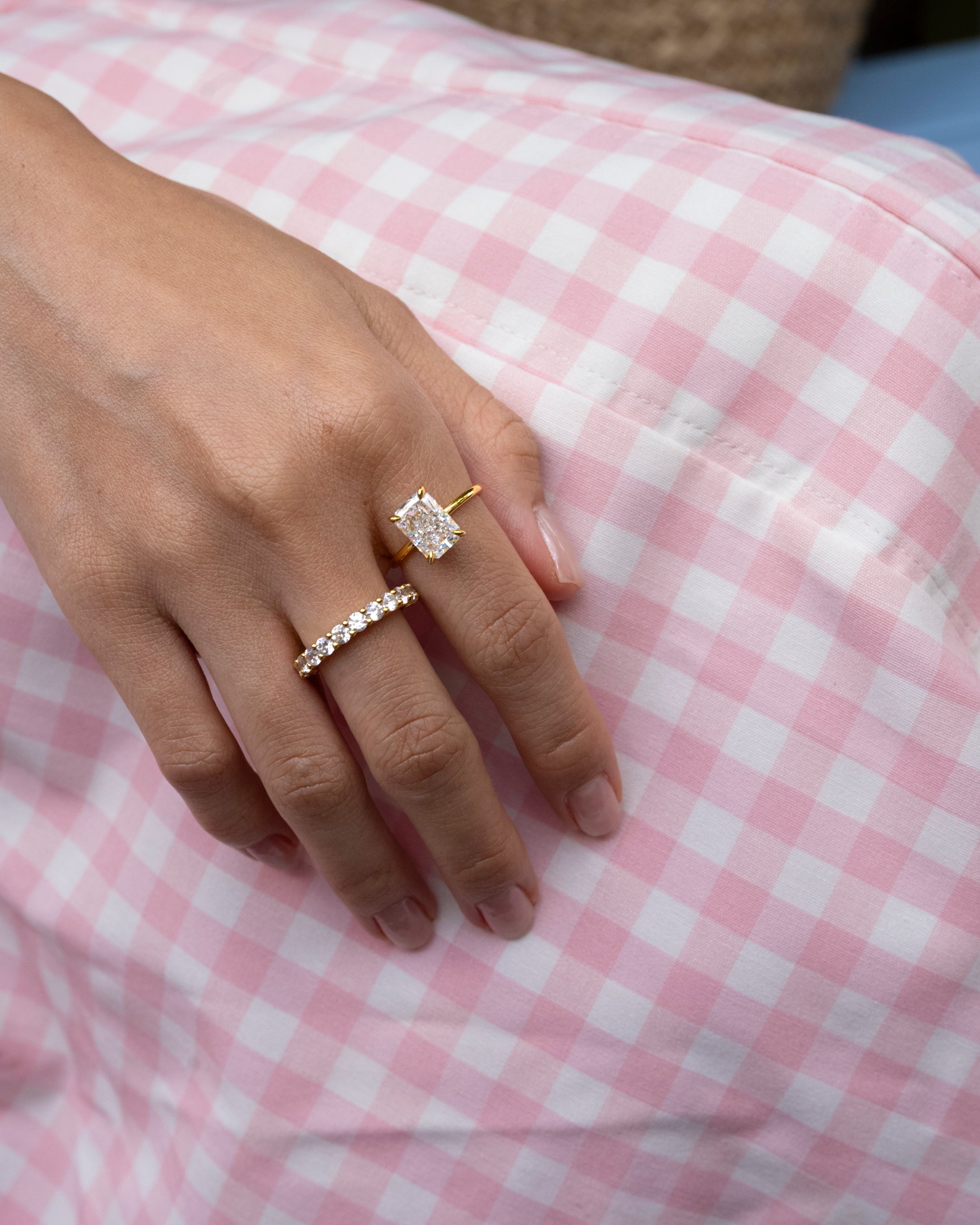 hand wearing elodie ring and dues ring