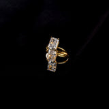 elodie ring stcked on a black background