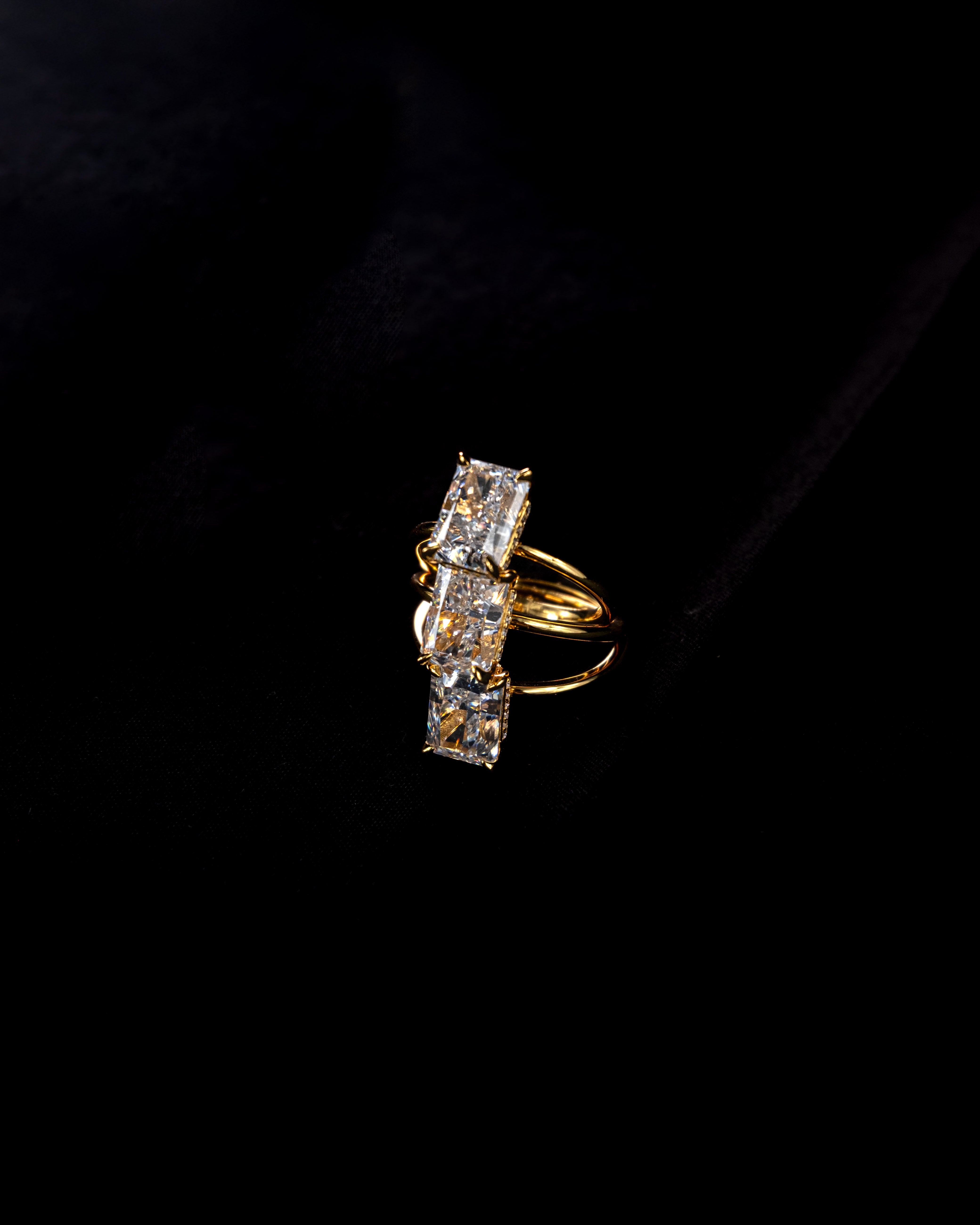 elodie ring stcked on a black background